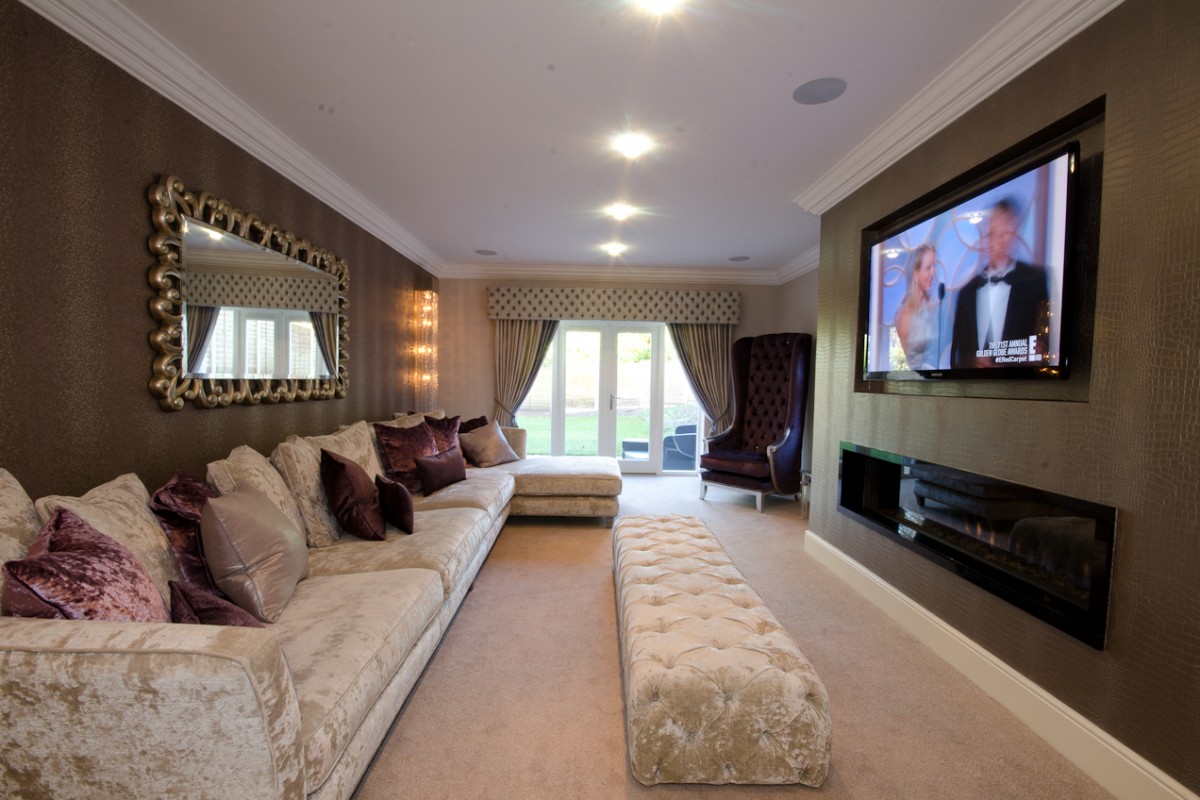 Sitting room design with bespoke 4 piece sofa, arm chairs, tablounge and designer wallpaper