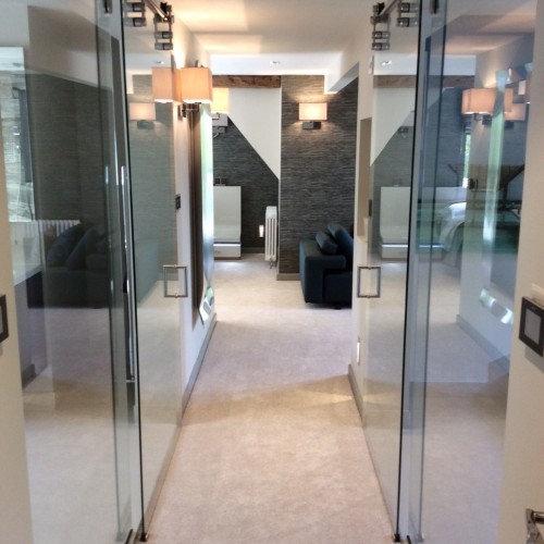 Glass Bathroom door in modern bedroom walk way design